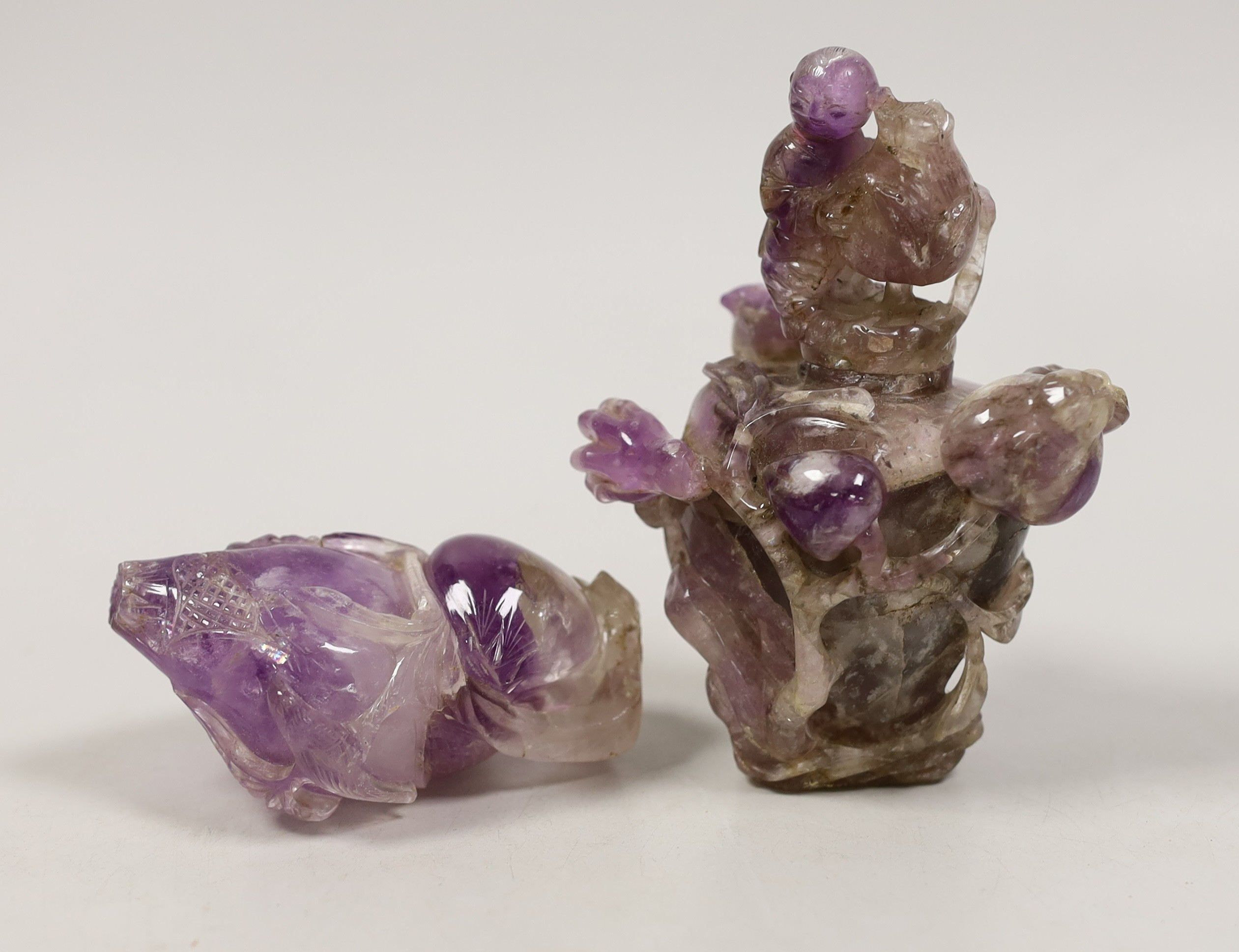 Two Chinese amethyst crystal carvings of peaches and a vase, tallest 8.5 cm